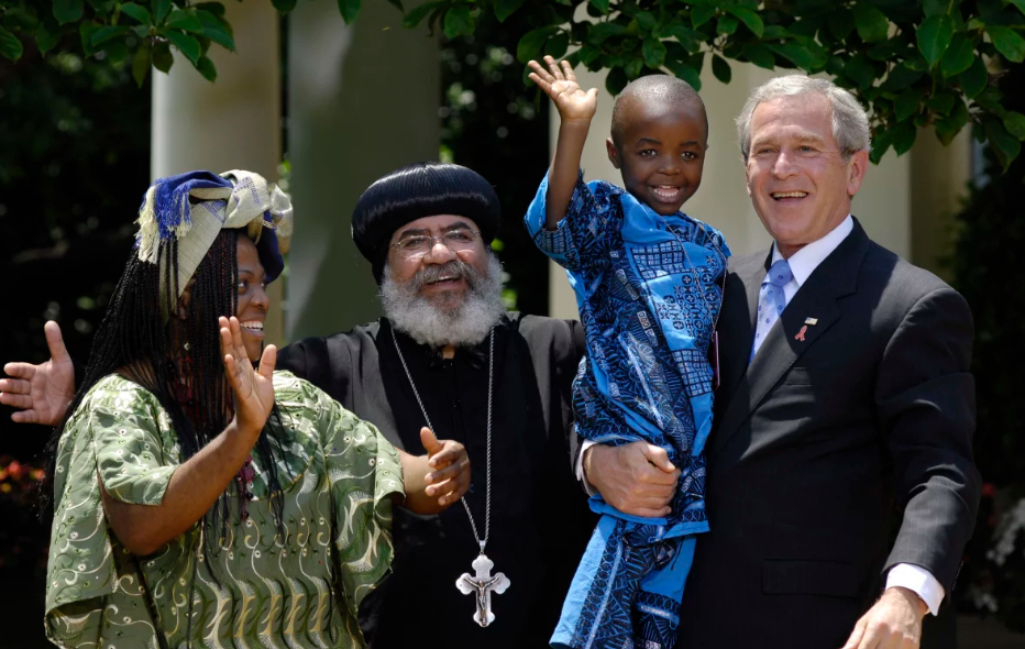 george-w-bush-holding-african-child